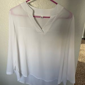 Small, white, long sleeved blouse